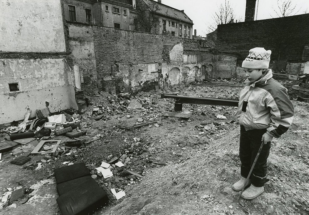 A young boy plays in the rubble of a demolished housing project in Connewitz. Restricted to personal, non-commercial use only. For permission to publish, contact Special Collections & Archives, George Mason University Libraries, speccoll@gmu.edu.