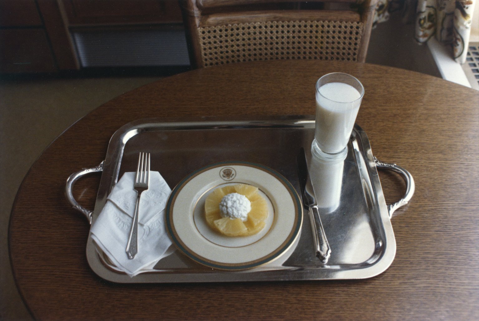 President Nixon's last meal in the White House: pineapple, cottage cheese and milk (August 9, 1974). Oliver F. Atkins photograph collection, Box 26, Folder 2. George Mason University. Libraries. Special Collections & Archives. Copyright not held by George Mason University Libraries. Restricted to personal, non-commercial use only. For permission to publish, contact Special Collections and Archives.