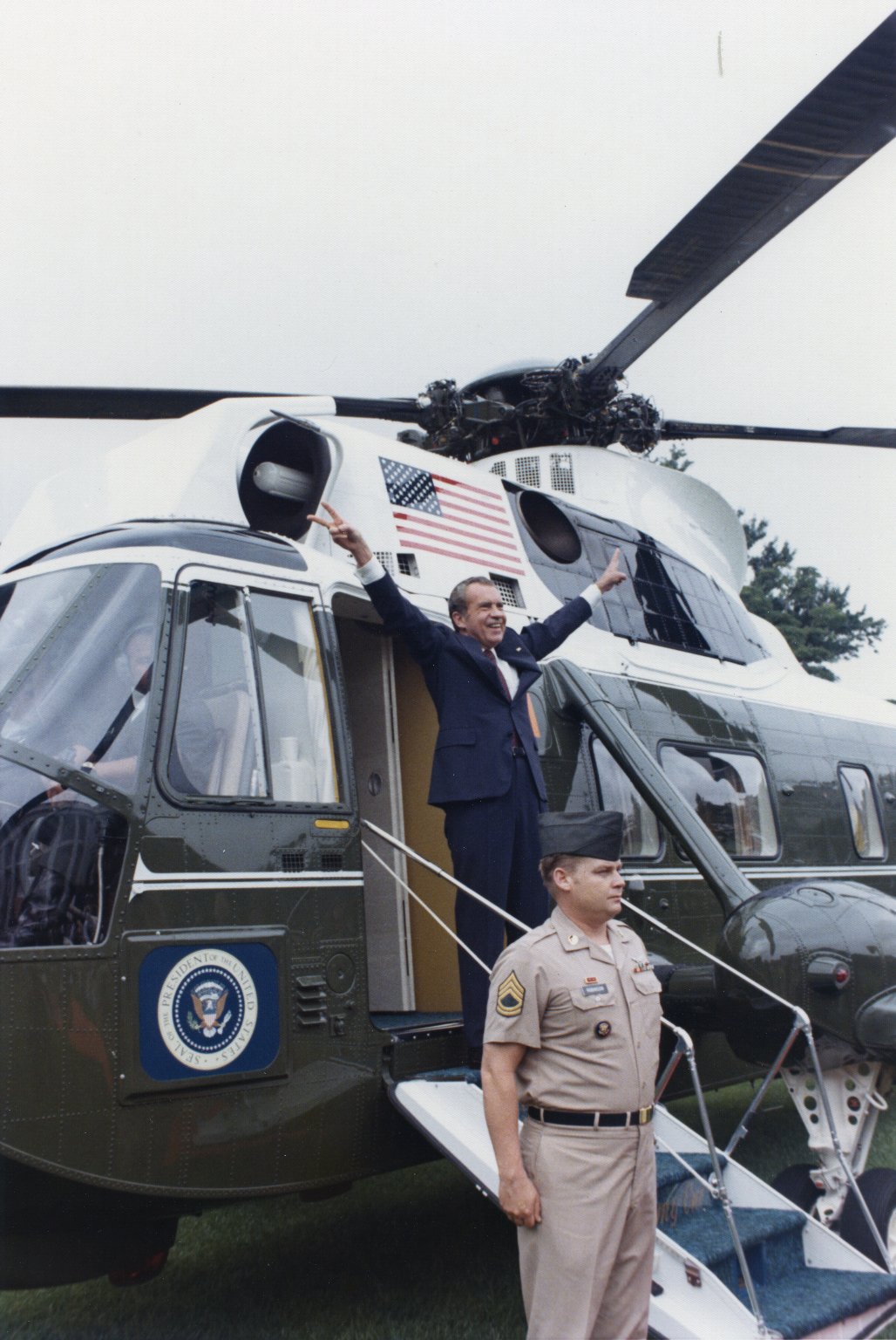 Nixon gives a final victory sign before he boards Marine One (August 9, 1974). Oliver F. Atkins photograph collection, Box 26, Folder 1. George Mason University. Libraries. Special Collections & Archives. Copyright not held by George Mason University Libraries. Restricted to personal, non-commercial use only. For permission to publish, contact Special Collections and Archives.